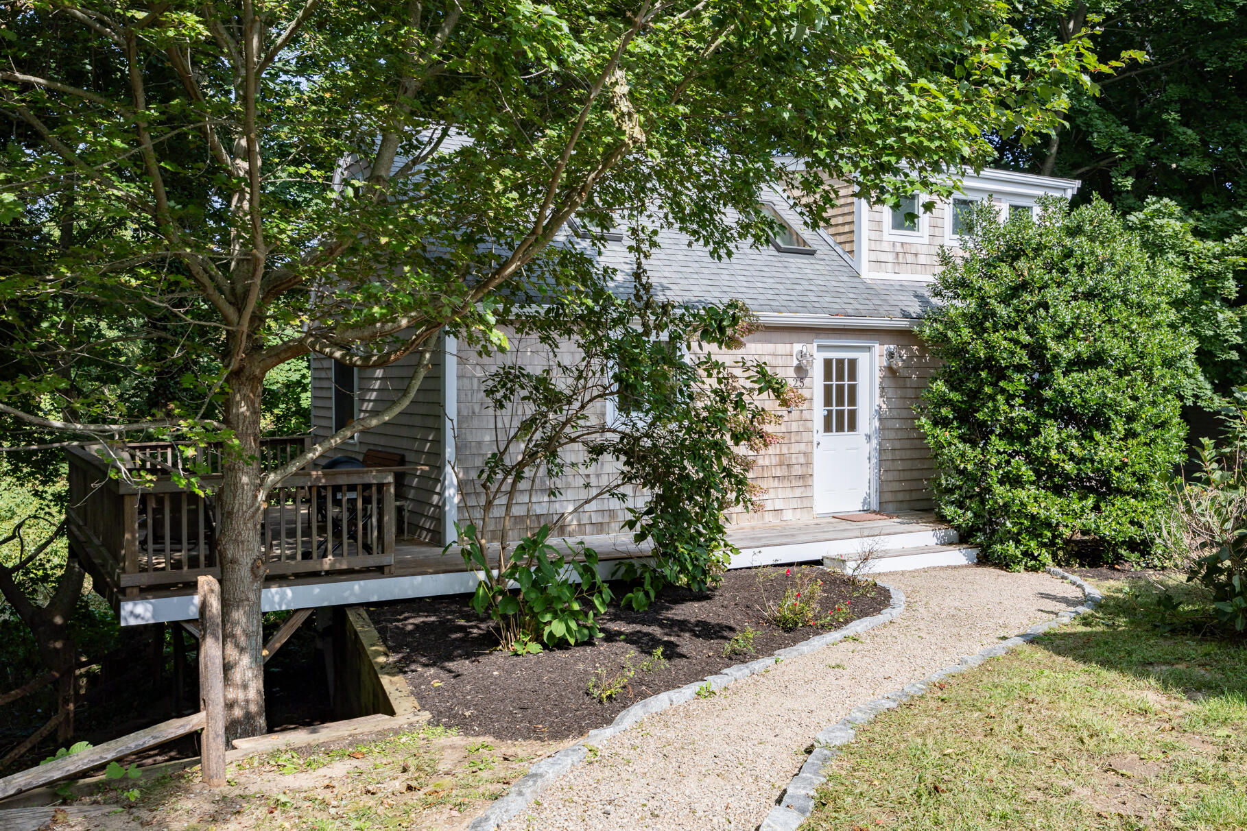 25 Locust Road Eastham, MA 02642 - Photo 1 of 41 a front view of a house with garden