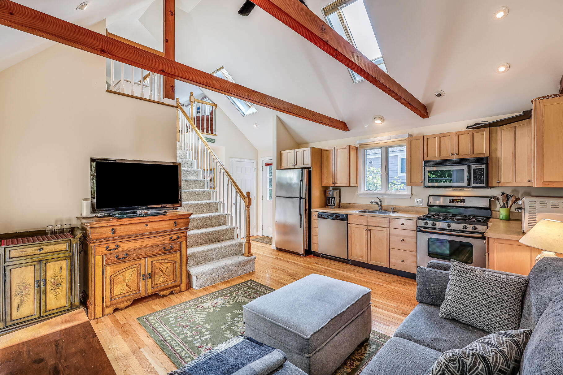 25 Locust Road Eastham, MA 02642 - Photo 3 of 41 a living room with stainless steel appliances furniture and a flat screen tv