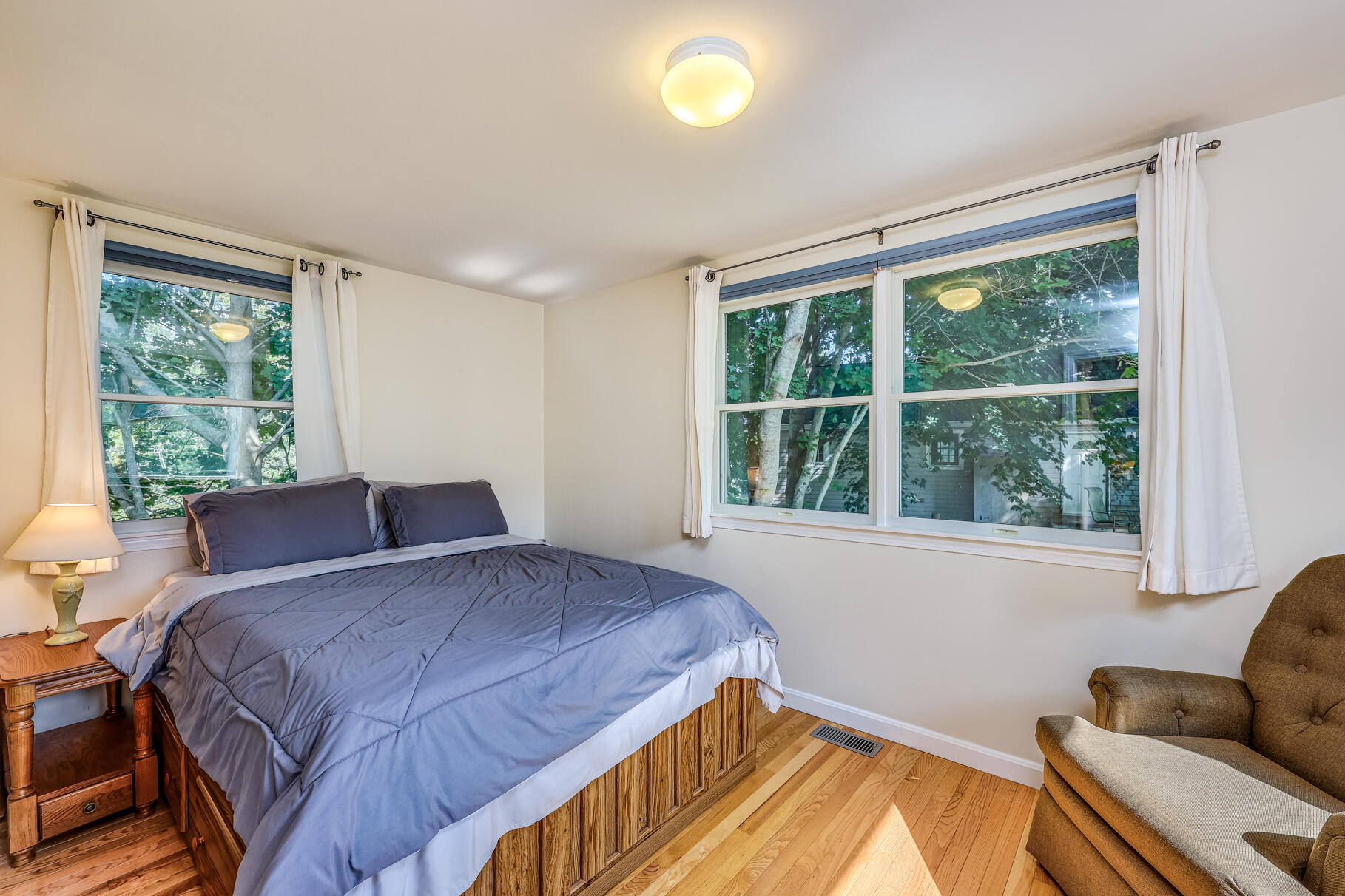 25 Locust Road Eastham, MA 02642 - Photo 5 of 41 a bedroom with a bed and a window