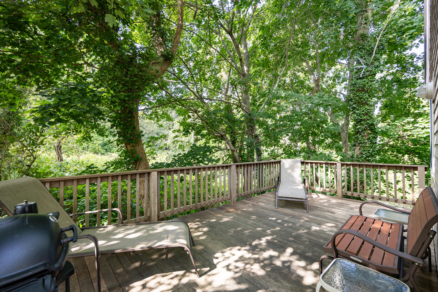 25 Locust Road Eastham, MA 02642 - Photo 8 of 41 a balcony with wooden floor table and chairs