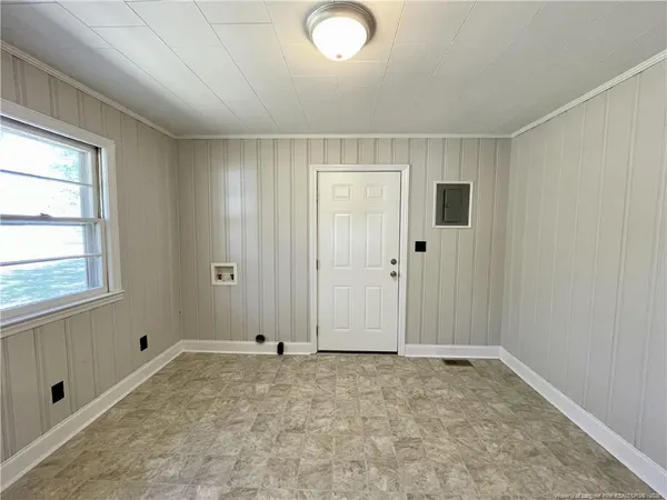 a view of an empty room and window