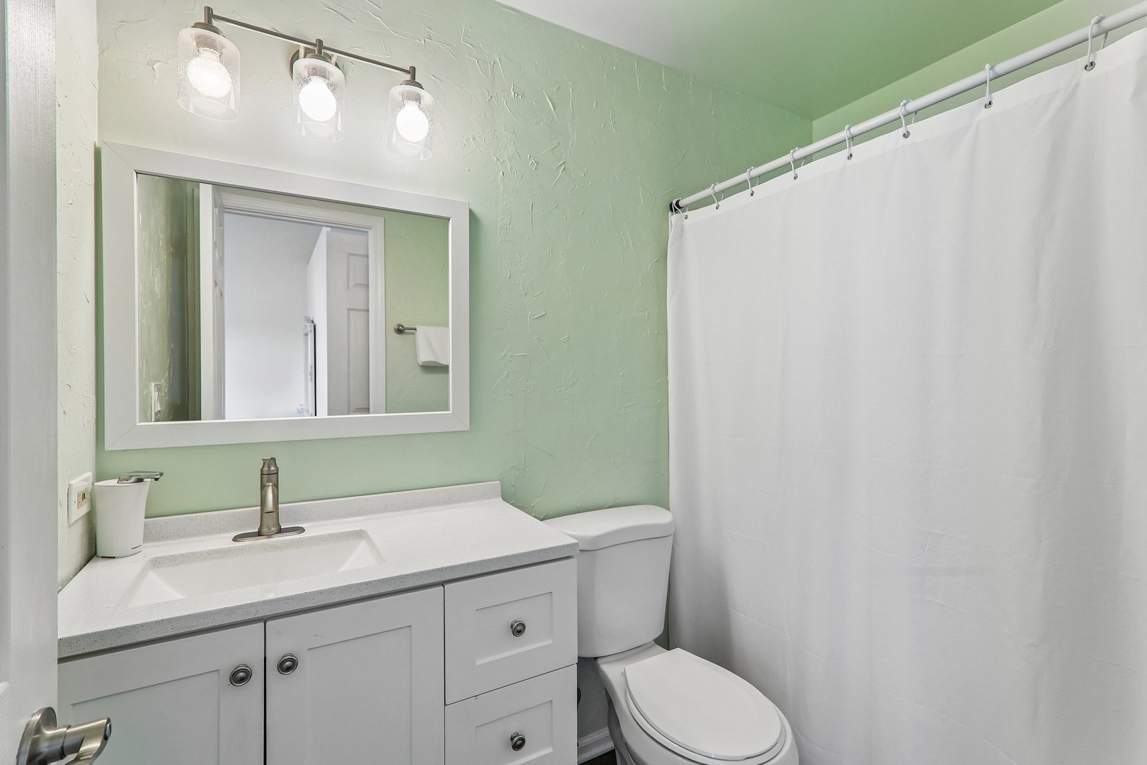 1064 Ripple Ridge Darien, IL 60561 - Photo 11 of 16 a bathroom with a sink a toilet and a mirror