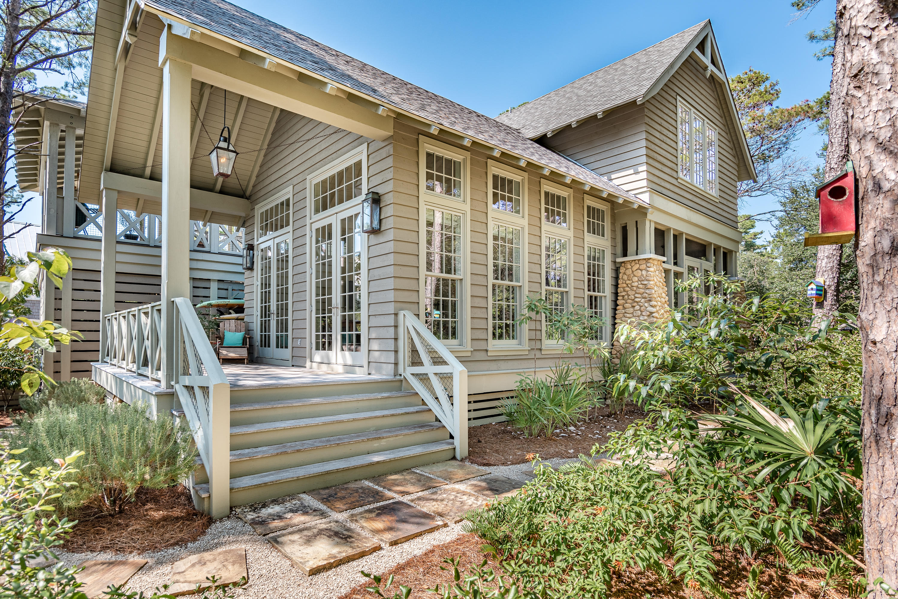 53 Cedar Post Road Santa Rosa Beach, FL 32459 - Photo 1 of 37 a front view of a house with a garden