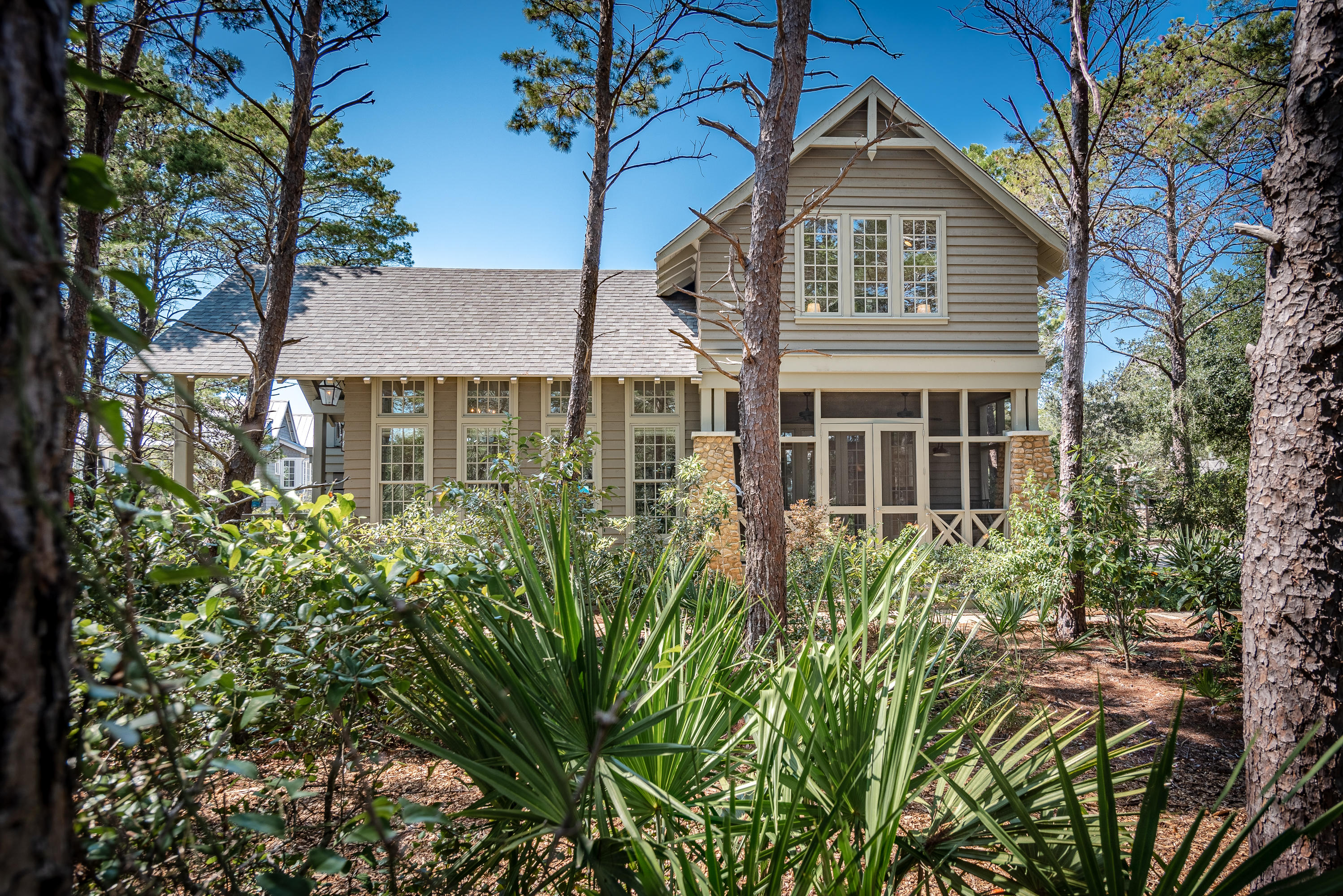 53 Cedar Post Road Santa Rosa Beach, FL 32459 - Photo 2 of 37 a front view of a house with a garden