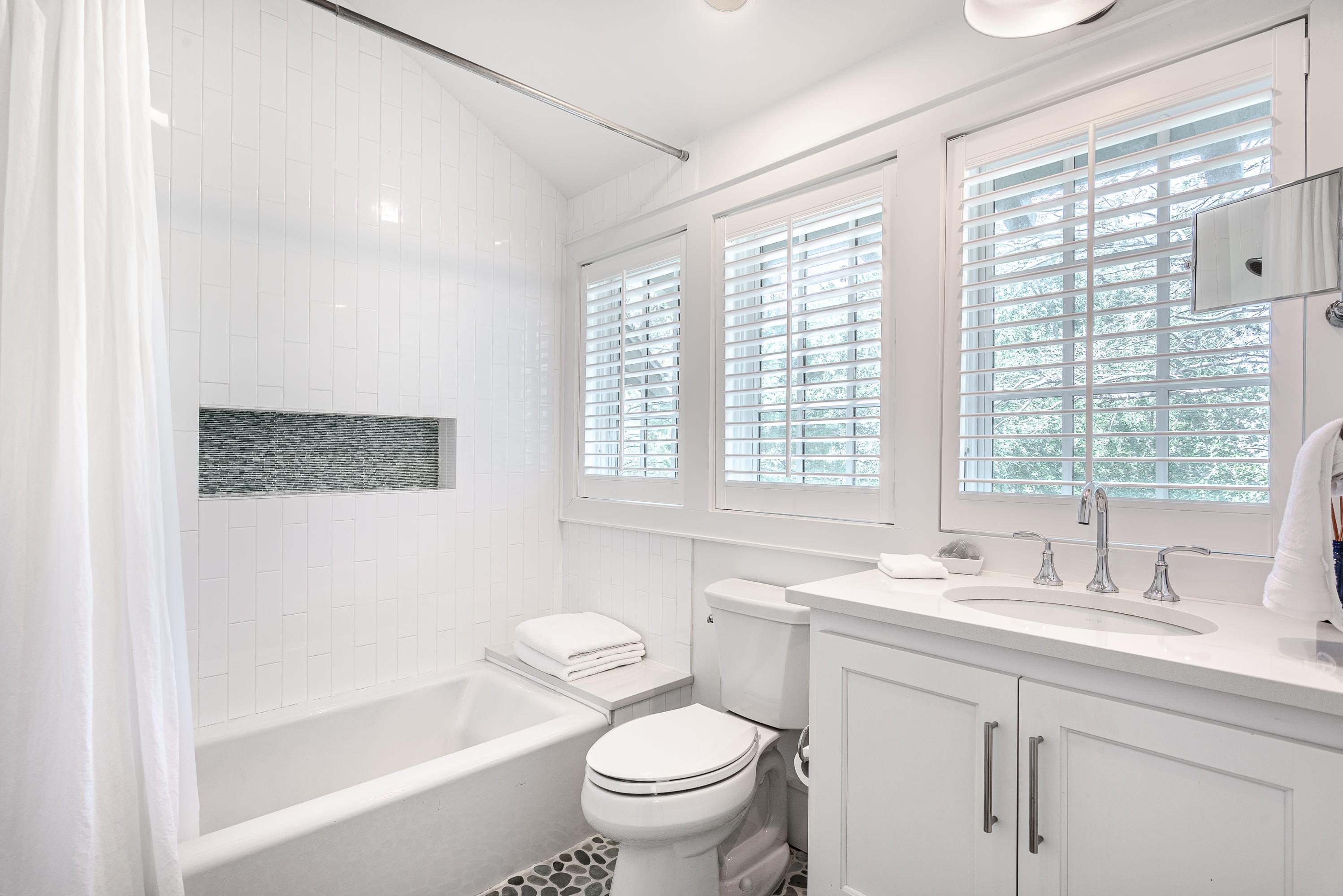 53 Cedar Post Road Santa Rosa Beach, FL 32459 - Photo 12 of 37 a bathroom with a granite countertop sink a large mirror a toilet and a bathtub