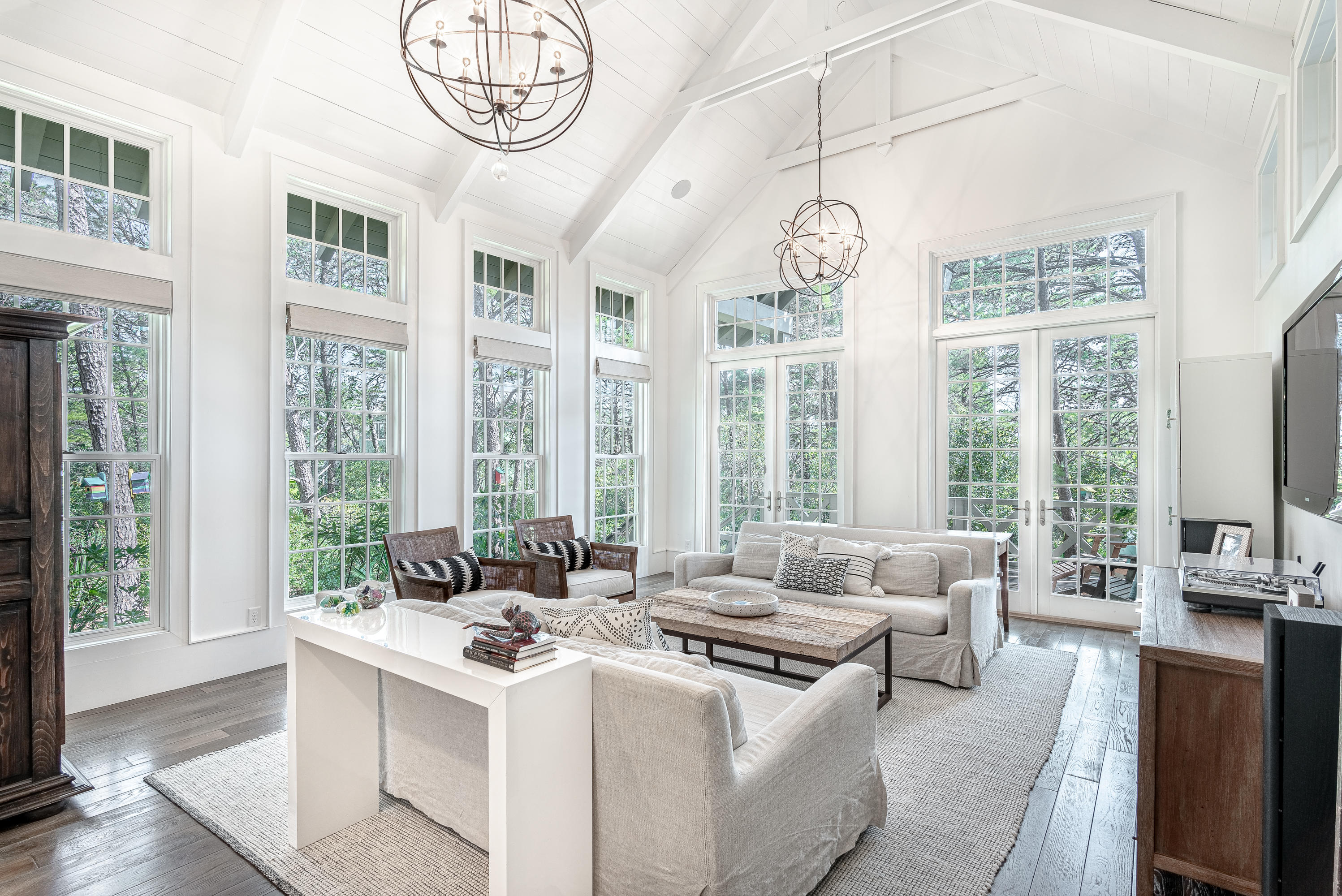 53 Cedar Post Road Santa Rosa Beach, FL 32459 - Photo 5 of 37 a view of a dining room with furniture large windows a chandelier and livingroom view
