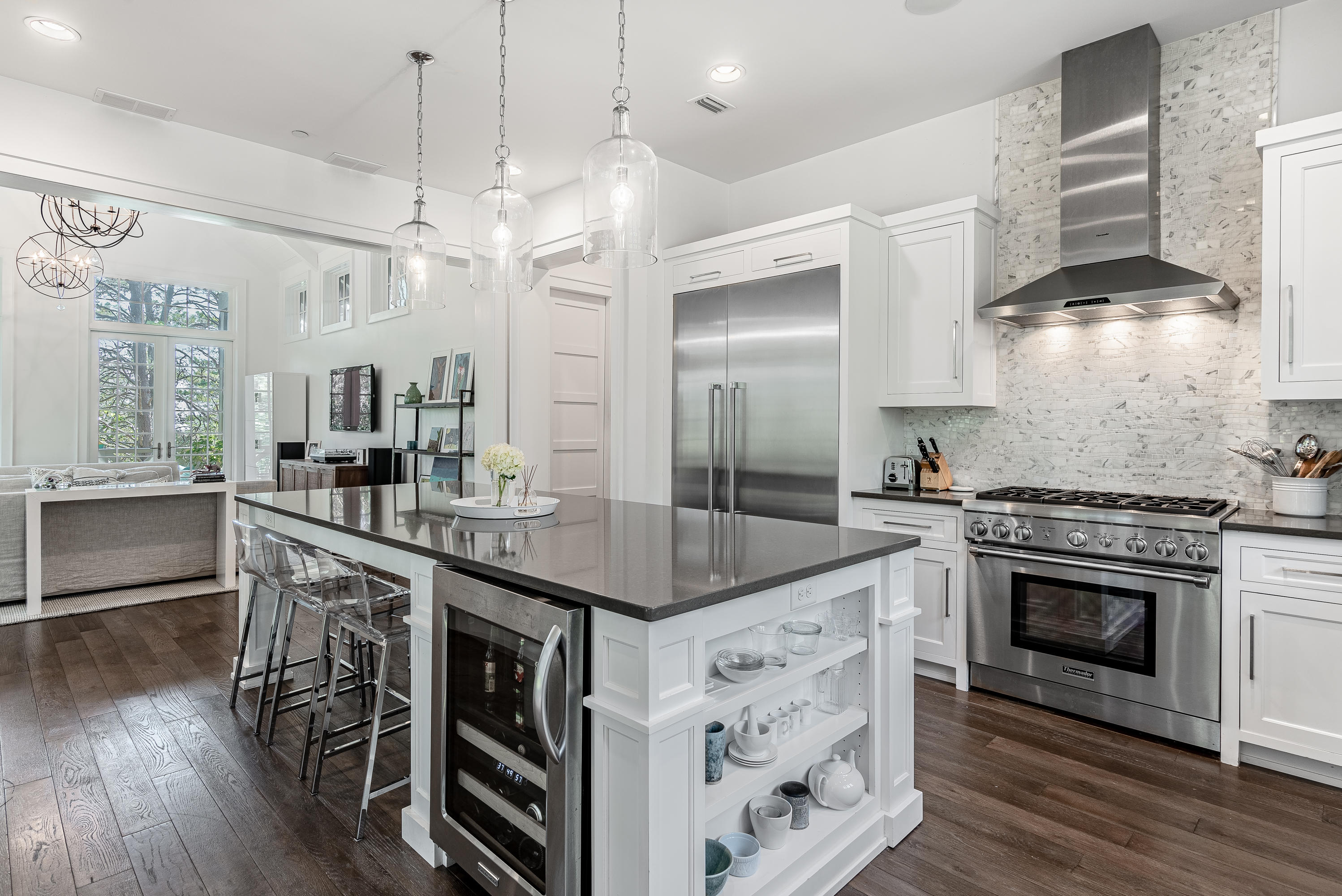 53 Cedar Post Road Santa Rosa Beach, FL 32459 - Photo 6 of 37 a kitchen with stainless steel appliances granite countertop a stove and a wooden floor