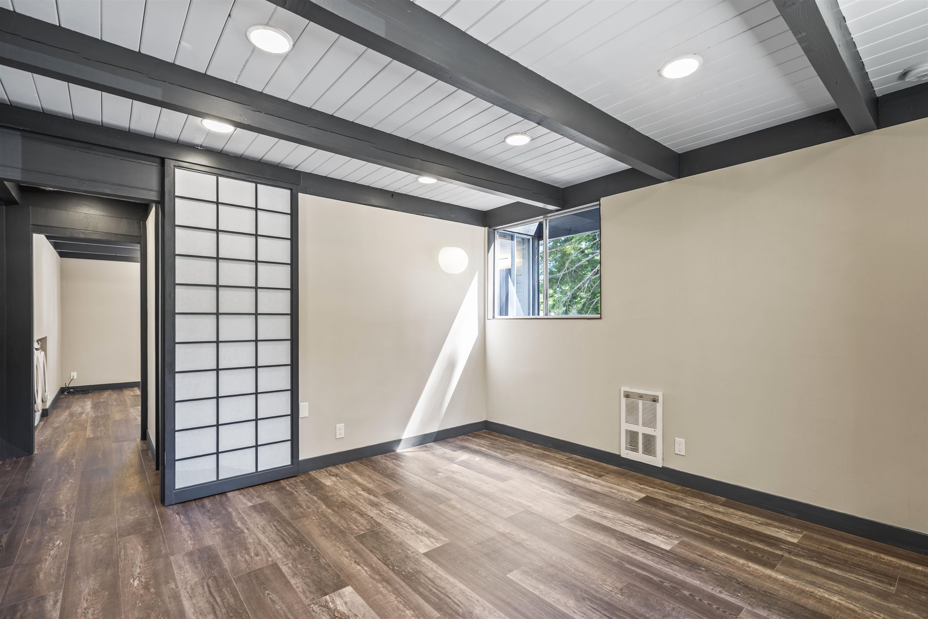 2570 Old Mammoth Road Mammoth Lakes, CA 93546 - Photo 21 of 39 Room featuring wood-finish flooring, exposed ceiling beams, recessed lighting, and a Shoji-style sli
