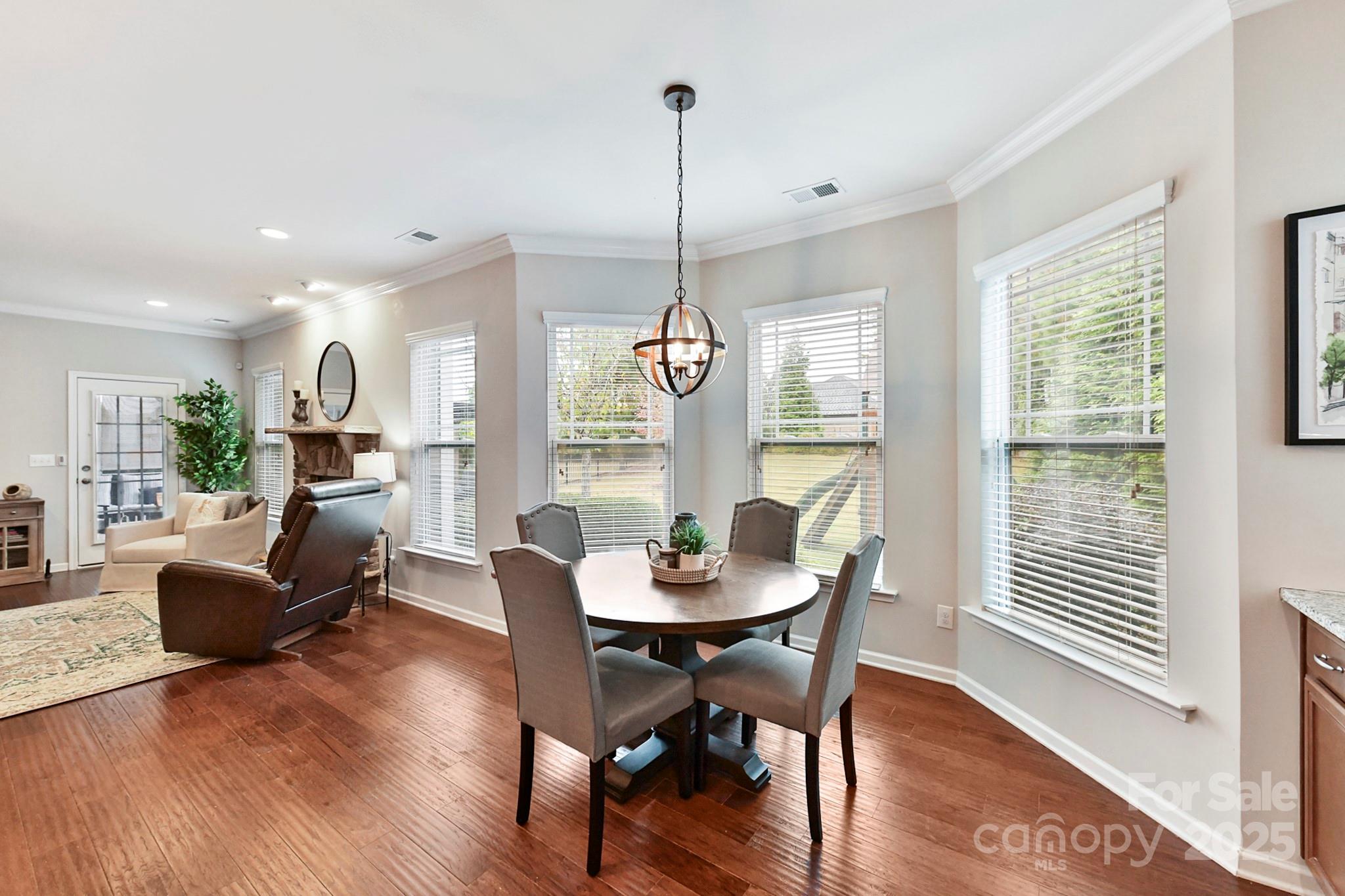 1084 Cameron Creek Parkway Tega Cay, SC 29708 - Photo 12 of 25 a dining room with furniture window wooden floor