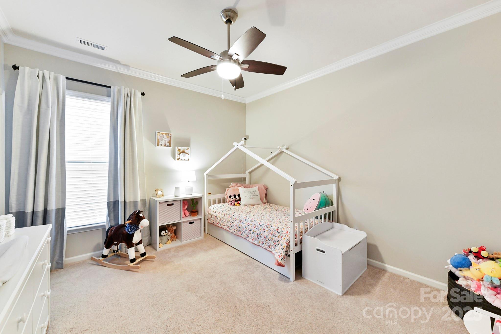 1084 Cameron Creek Parkway Tega Cay, SC 29708 - Photo 18 of 25 a living room with furniture and a chandelier