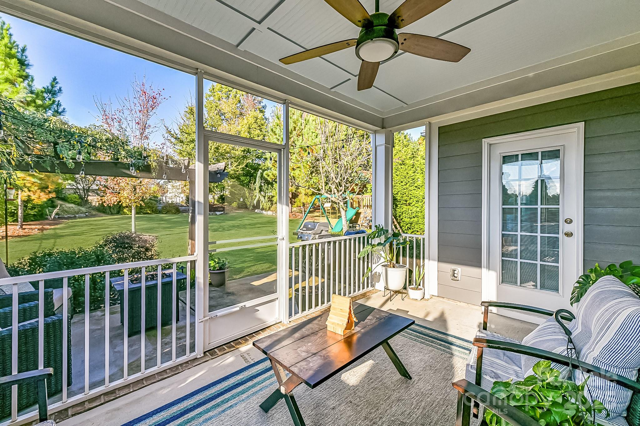 1084 Cameron Creek Parkway Tega Cay, SC 29708 - Photo 20 of 25 a living room with furniture and a floor to ceiling window
