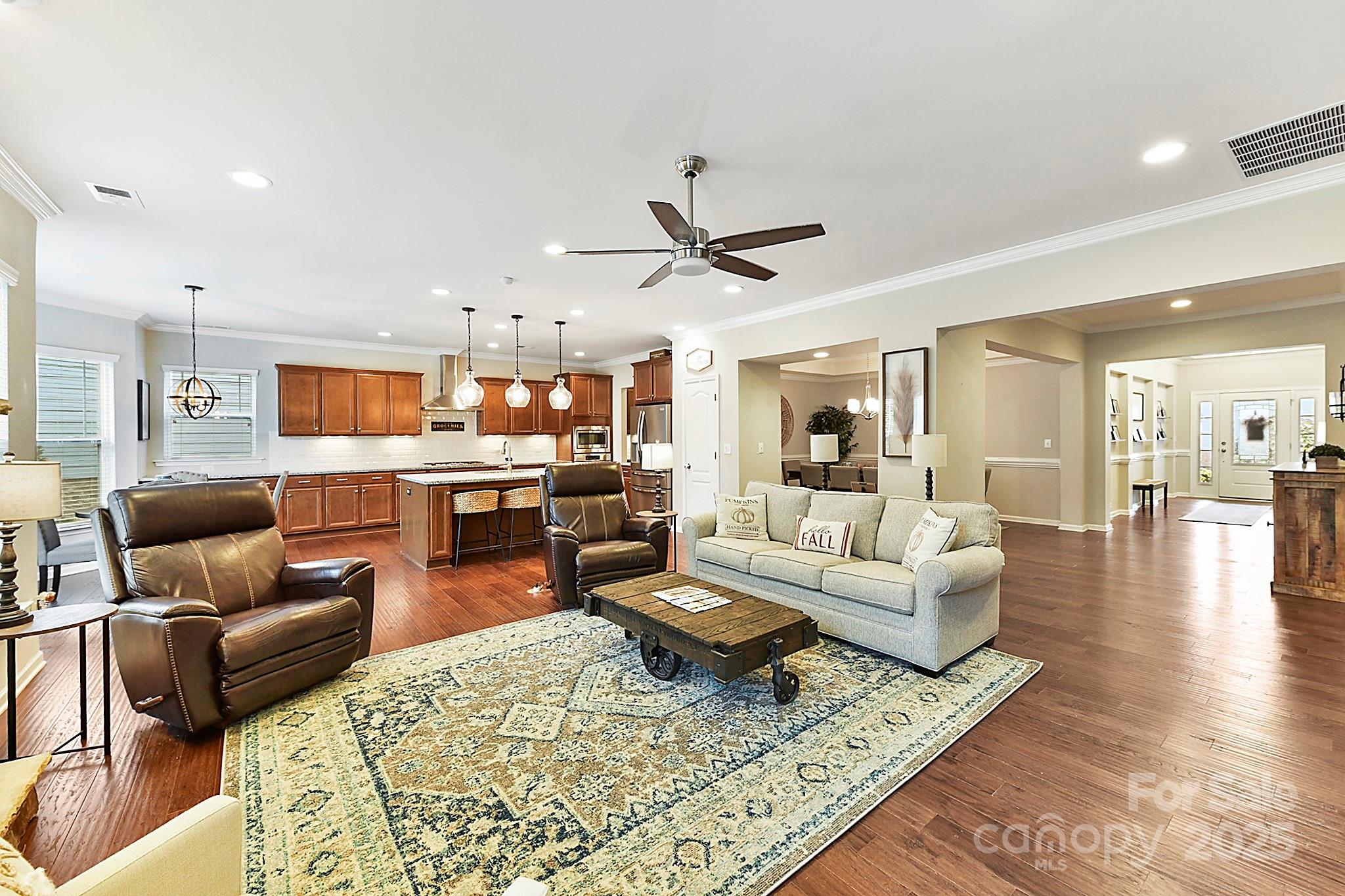 1084 Cameron Creek Parkway Tega Cay, SC 29708 - Photo 6 of 25 a living room with furniture kitchen view and a table
