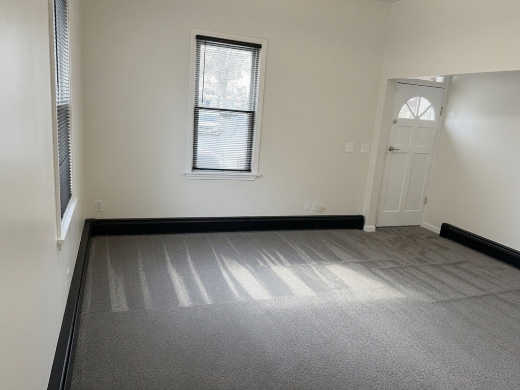 37 Madison Street, Unit 37 Malden, MA 02148 - Photo 10 of 10 an empty room with windows