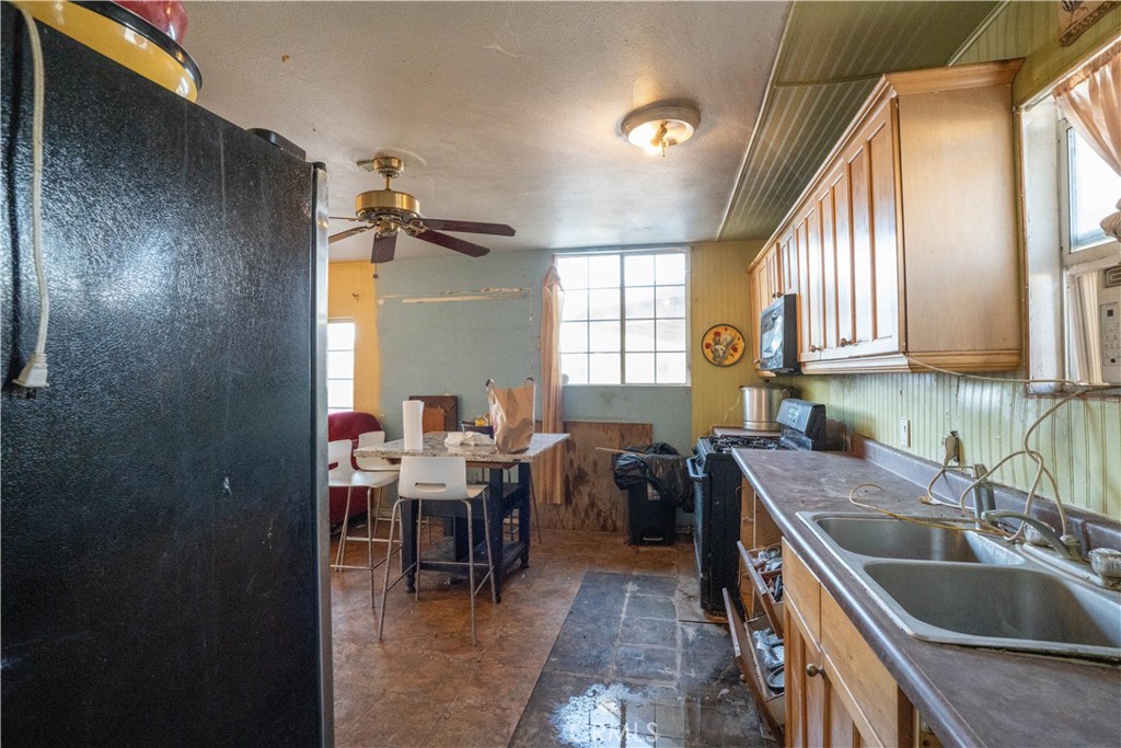6174 Jurupa Avenue Riverside, CA 92504 - Photo 14 of 30 a kitchen with sink cabinets and window