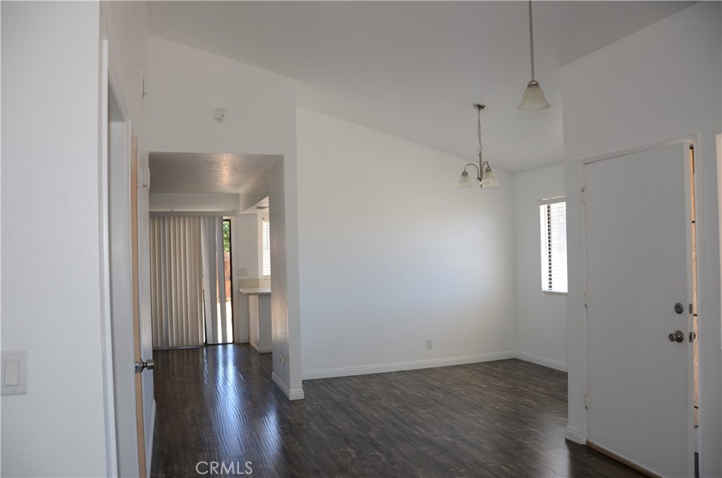 43600 Santa Rosa Circle Lancaster, CA 93535 - Photo 20 of 25 an empty room with wooden floor and windows