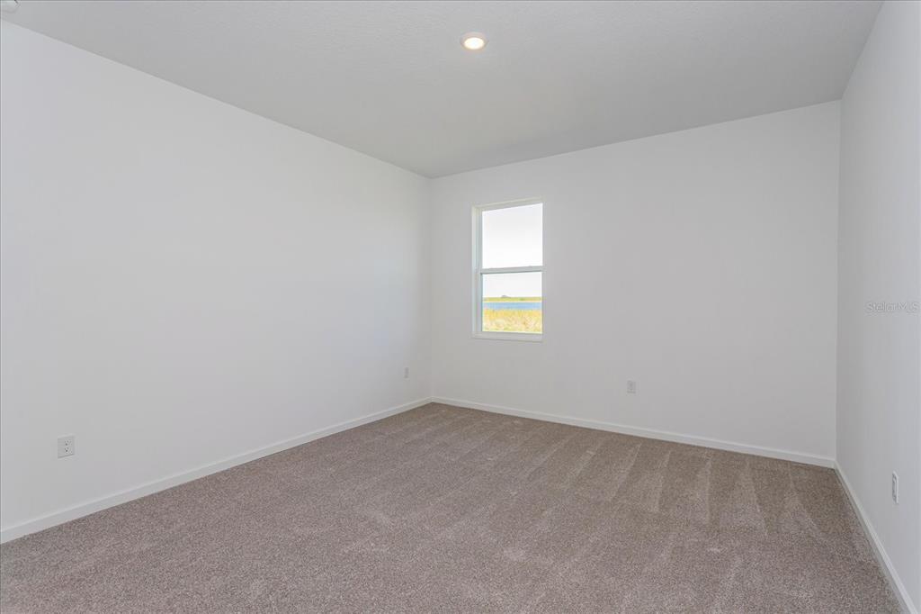 1010 Swamp Chestnut Loop Lady Lake, FL 32159 - Photo 8 of 22 an empty room with a window
