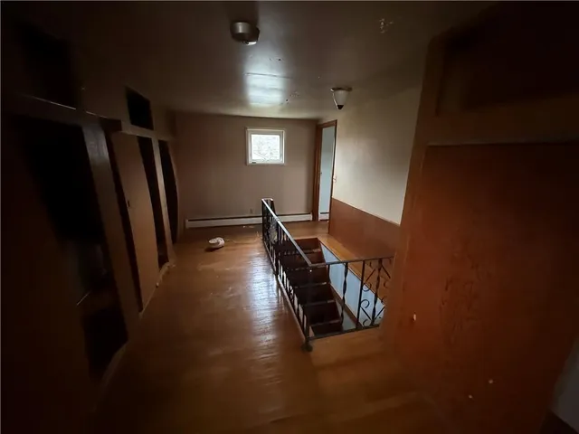 a view of a hallway with windows