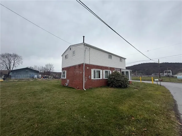 a view of a house with a big yard