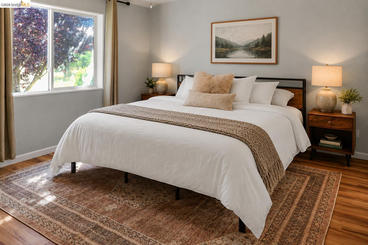 4419 Little John Road Copperopolis, CA 95228 - Photo 11 of 43 Bedroom featuring hardwood-style flooring, a large window with white trim, and light-toned wall paint