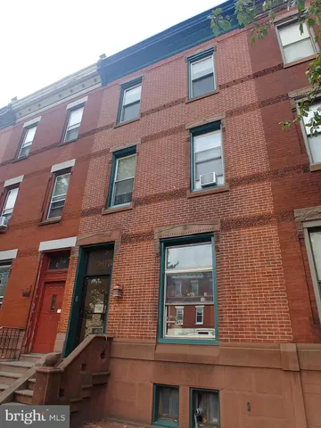 a view of a street with sitting area