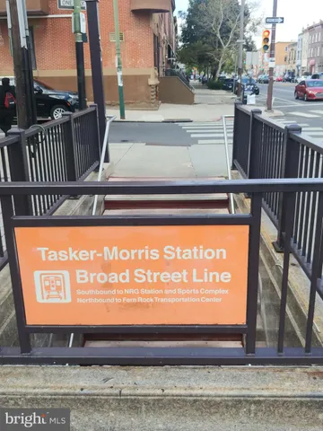 a car parked in front of a brick building