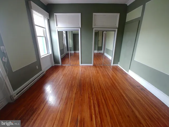 a view of gallery with wooden floor