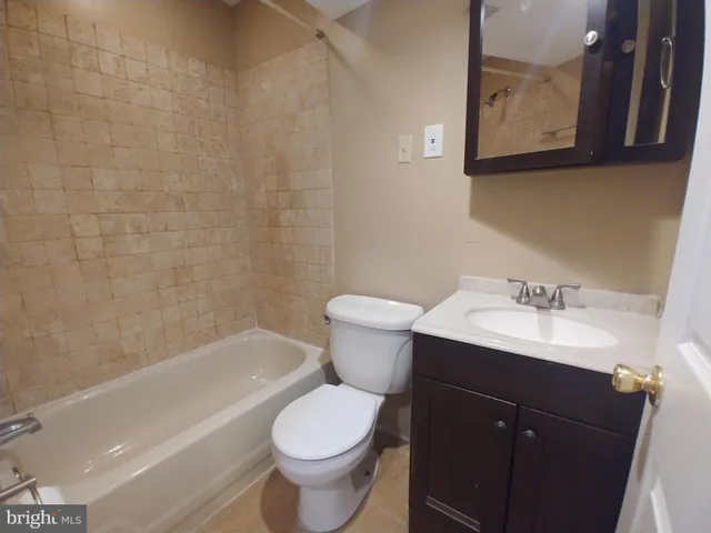 a bathroom with a sink toilet and bathtub