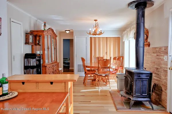 a kitchen with stainless steel appliances wooden cabinets a sink and a stove