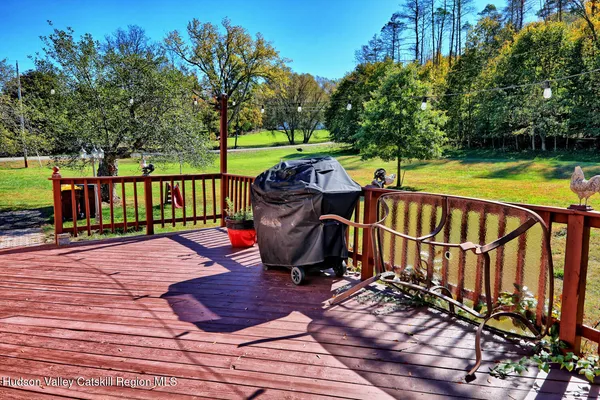 a view of a house with a yard porch and sitting area