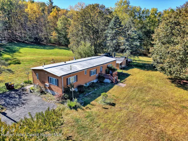 a view of a lake with a yard