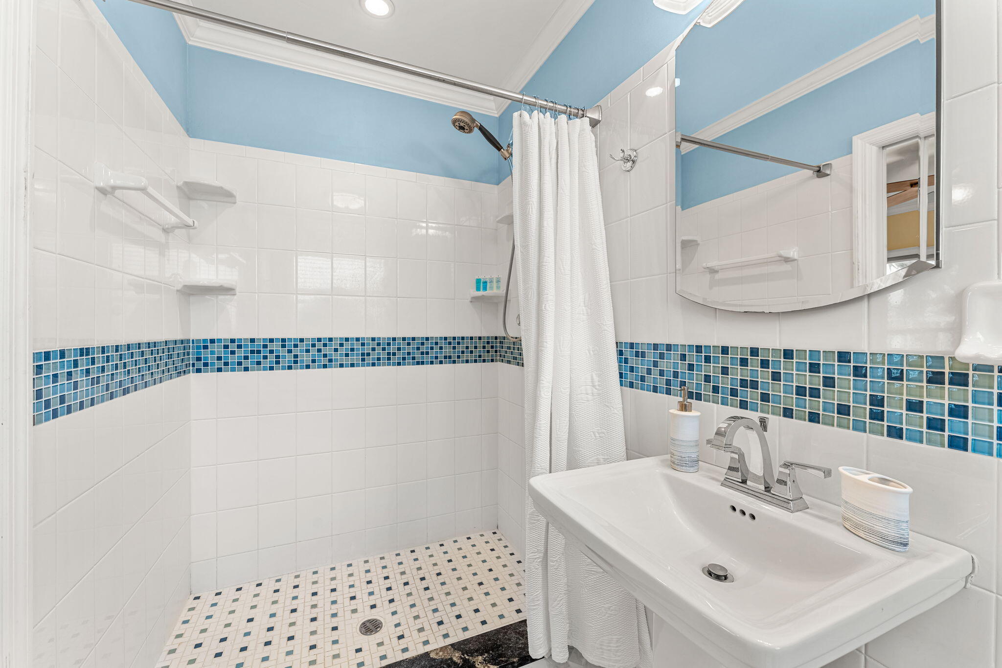 428 Dempsey Drive Cocoa Beach, FL 32931 - Photo 11 of 25 a bathroom with a sink and a mirror