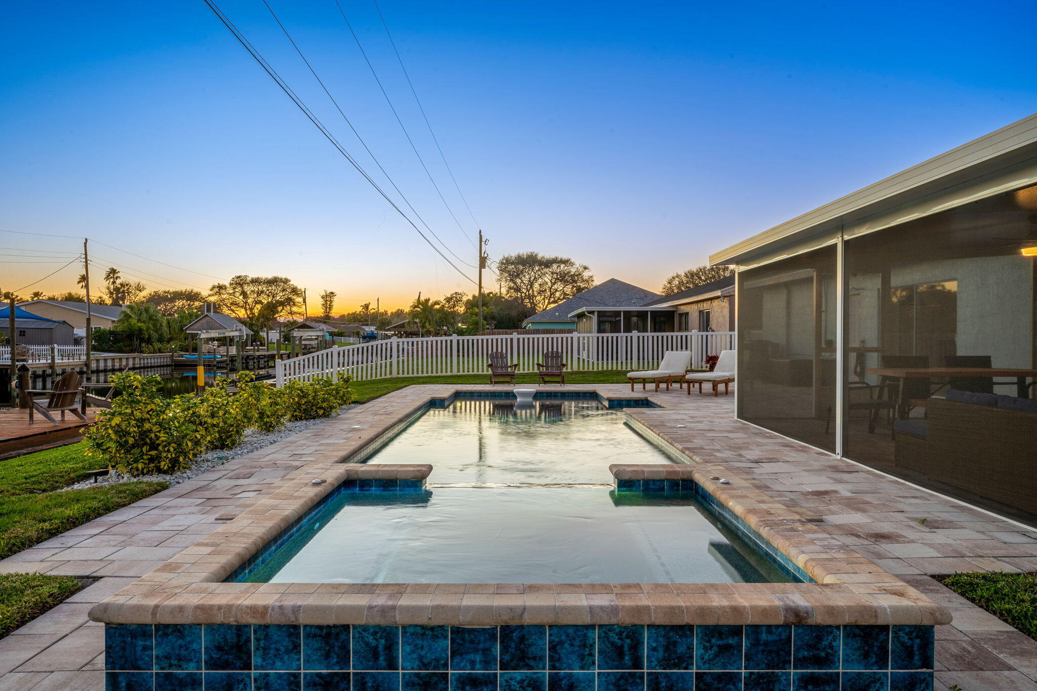 428 Dempsey Drive Cocoa Beach, FL 32931 - Photo 17 of 25 a swimming pool with outdoor seating and yard