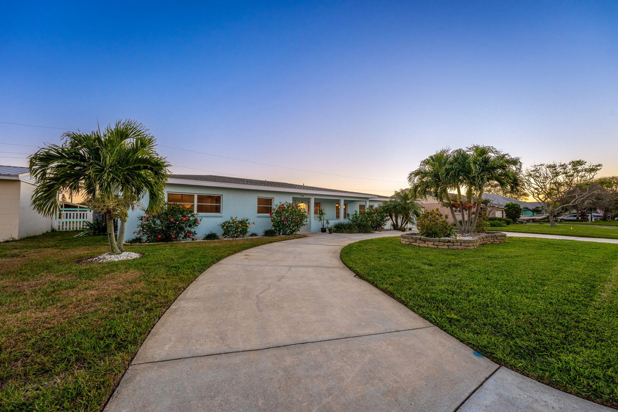 428 Dempsey Drive Cocoa Beach, FL 32931 - Photo 25 of 25 a front view of house with yard and green space