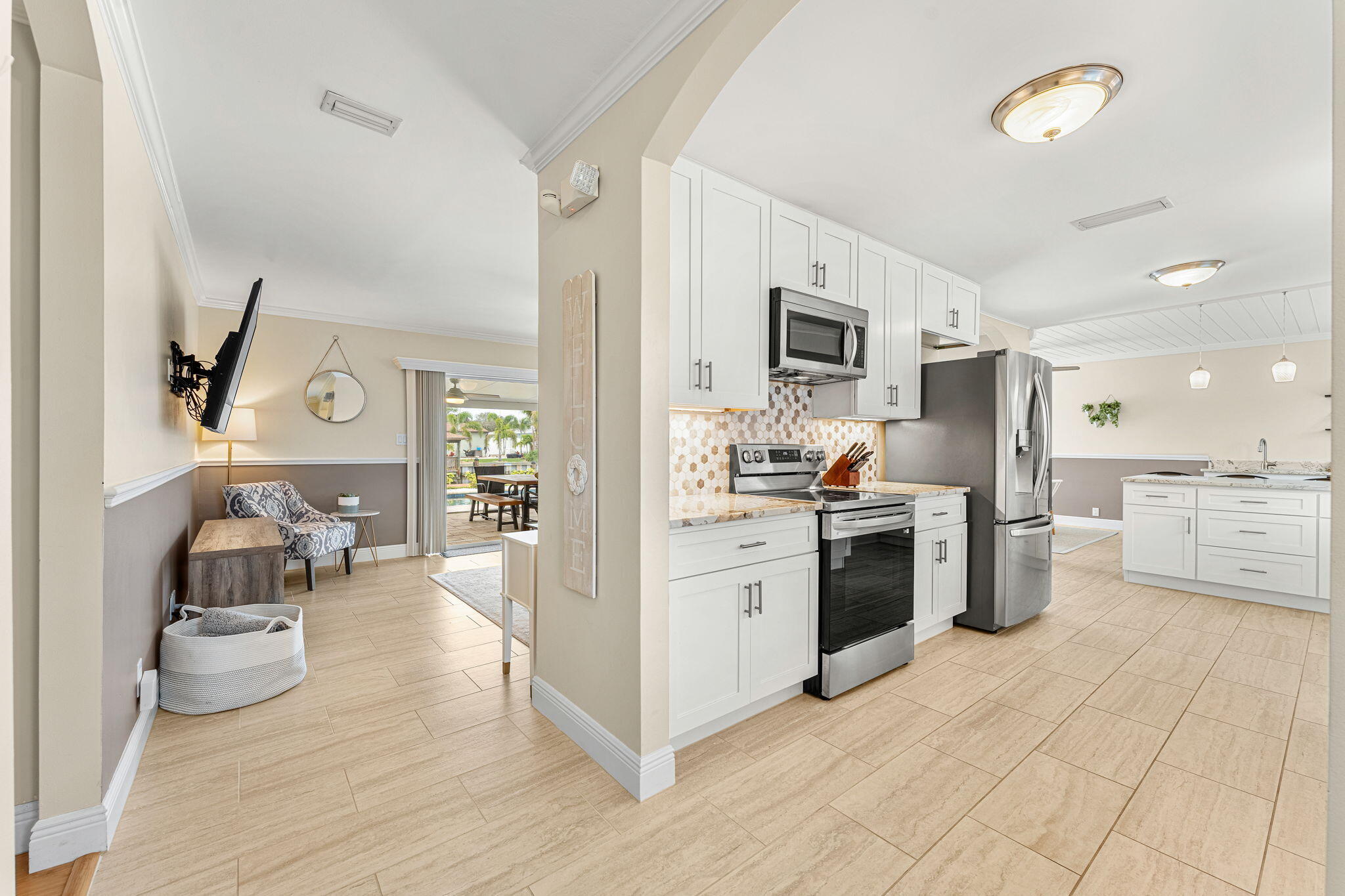 428 Dempsey Drive Cocoa Beach, FL 32931 - Photo 4 of 25 a kitchen with a sink and a stove top oven