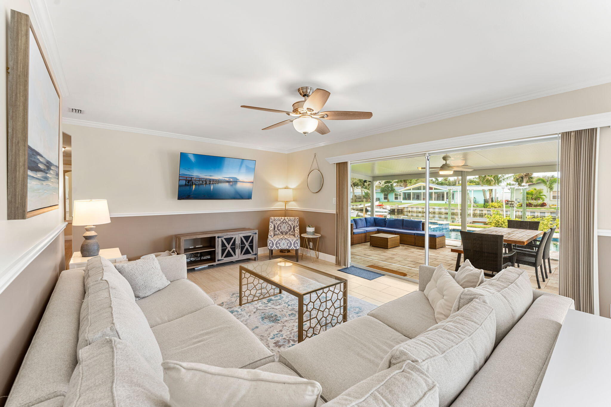 428 Dempsey Drive Cocoa Beach, FL 32931 - Photo 5 of 25 a living room with furniture and a large window