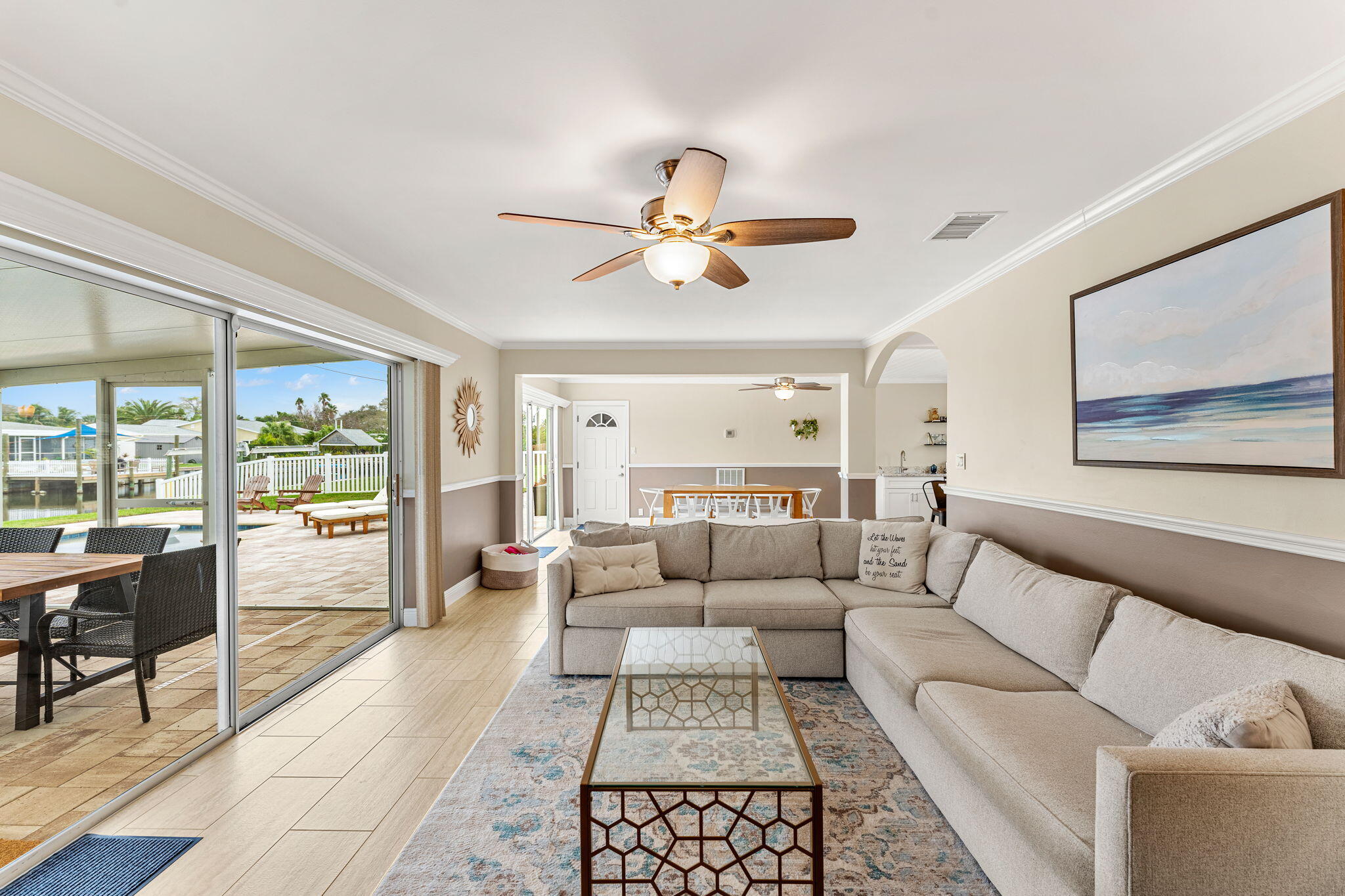 428 Dempsey Drive Cocoa Beach, FL 32931 - Photo 6 of 25 a living room with furniture and a large window