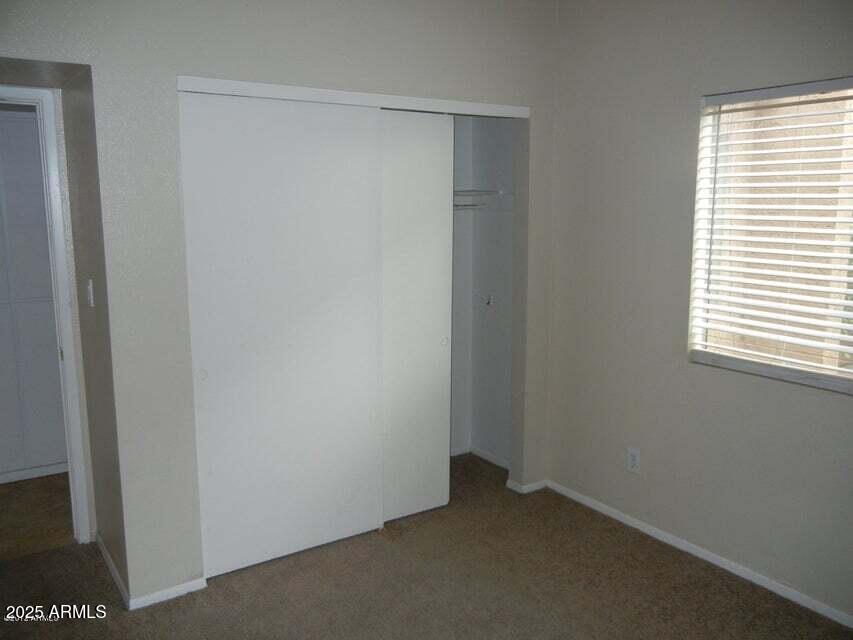 1849 East Kirkland Lane Tempe, AZ 85288 - Photo 10 of 12 a view of an empty room with a window