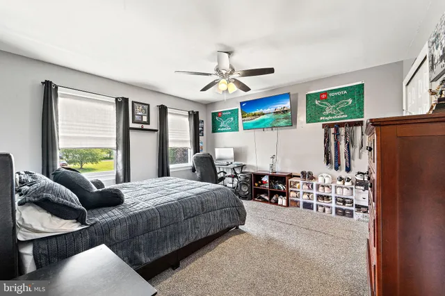 a bed room with a bed and a chandelier
