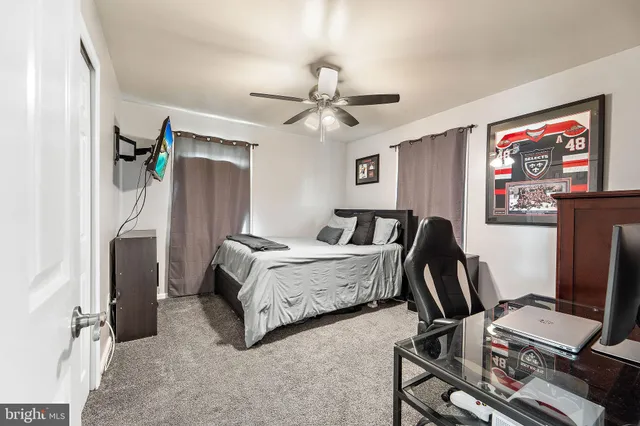 a bedroom with furniture and a bed