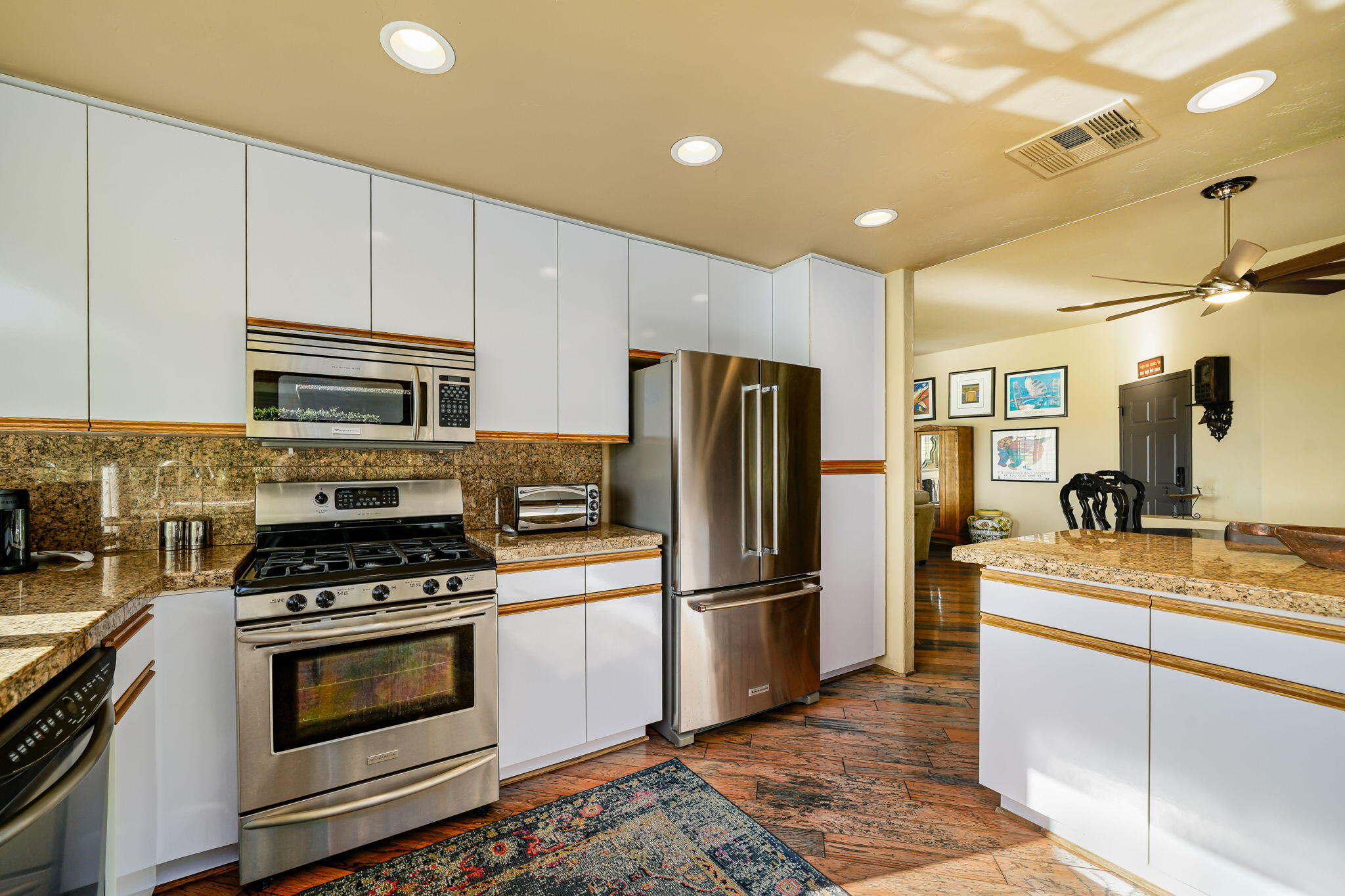 55 Colonial Drive Rancho Mirage, CA 92270 - Photo 11 of 31 a kitchen with granite countertop a refrigerator stove and sink