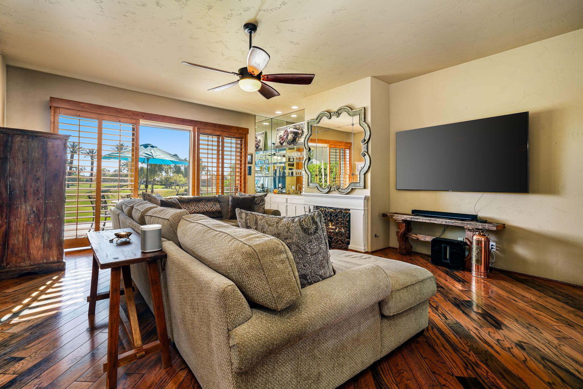 55 Colonial Drive Rancho Mirage, CA 92270 - Photo 13 of 31 a living room with furniture and a flat screen tv