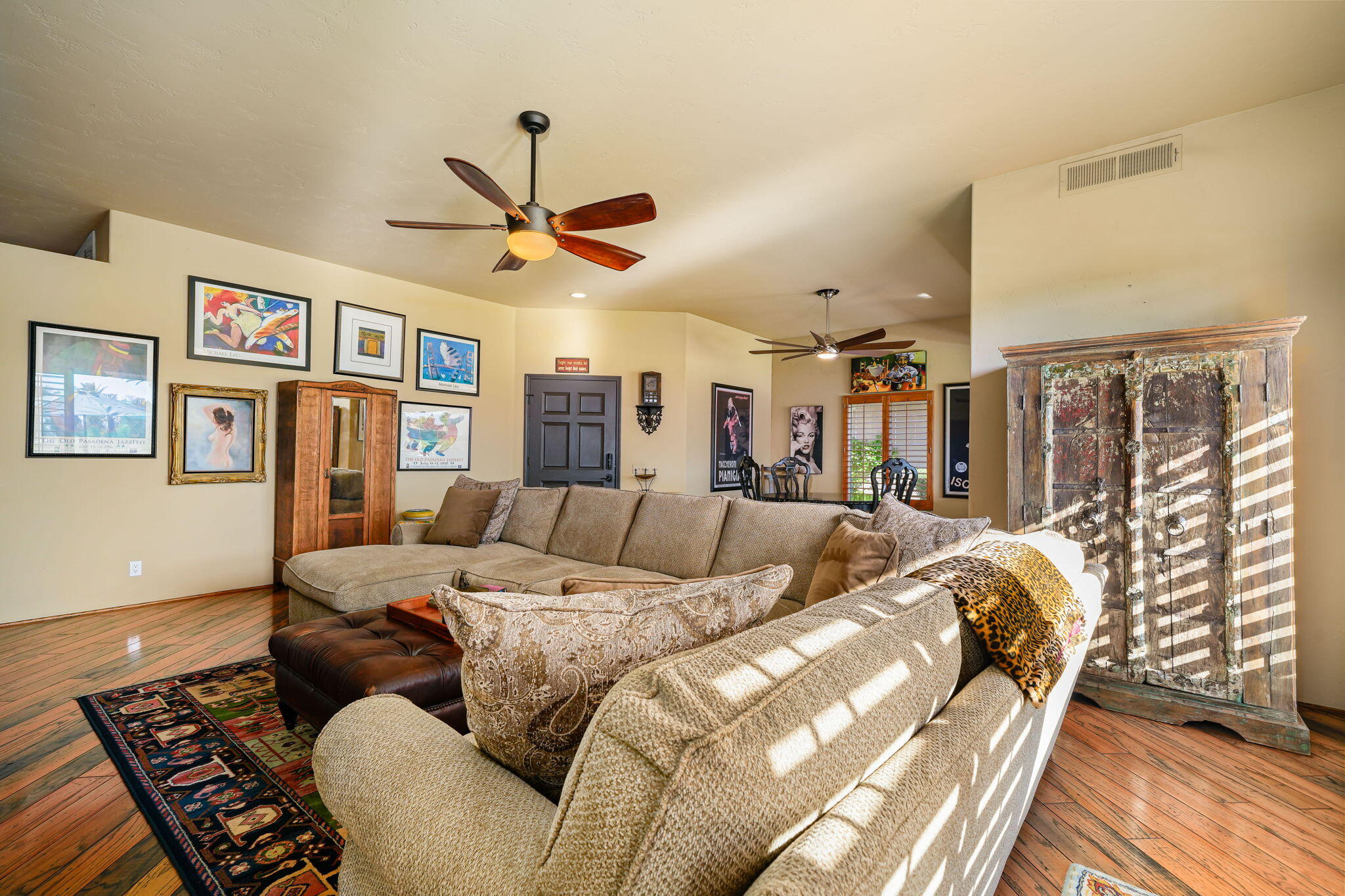 55 Colonial Drive Rancho Mirage, CA 92270 - Photo 15 of 31 a living room with furniture ceiling fan and a rug