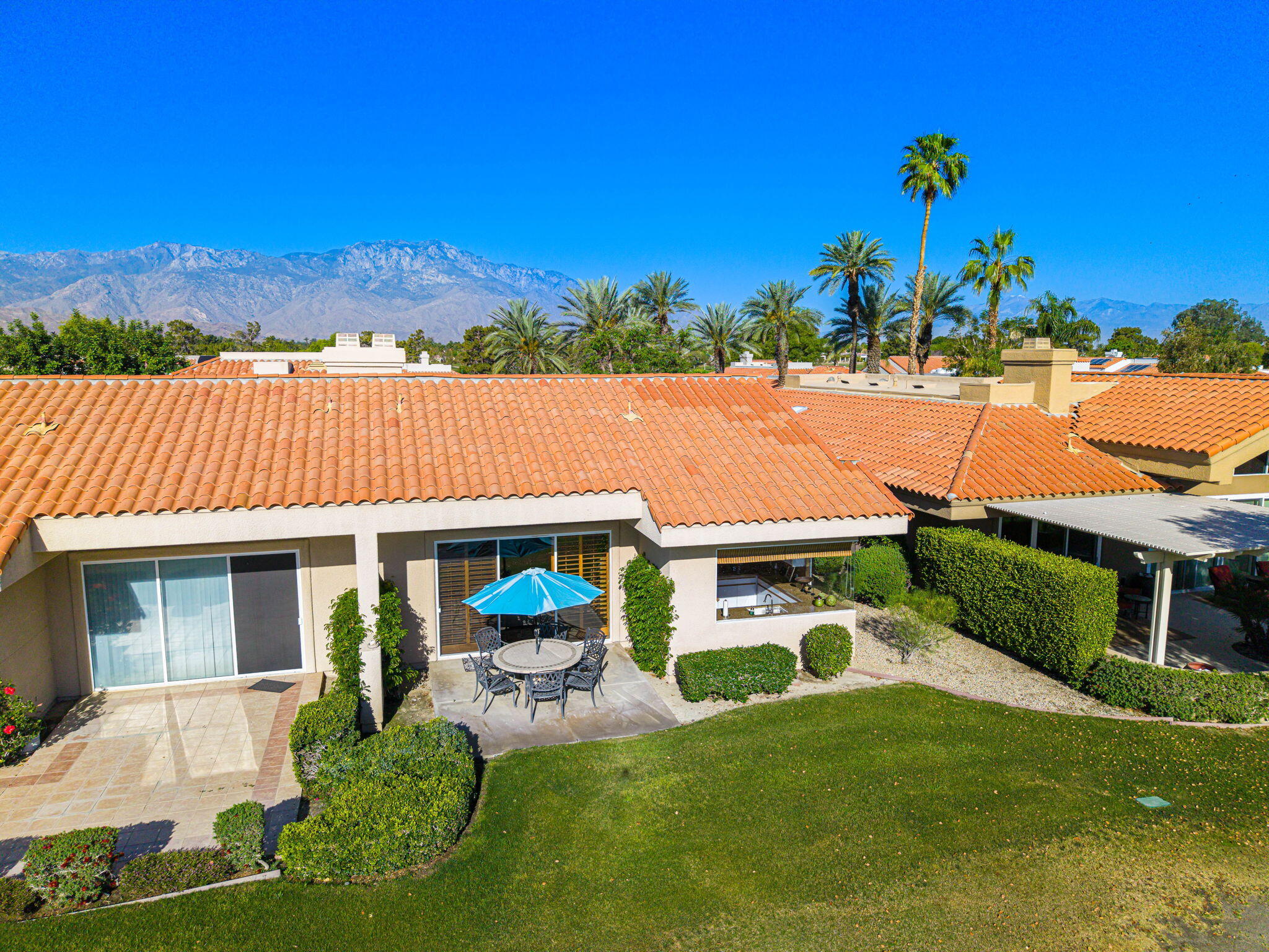 55 Colonial Drive Rancho Mirage, CA 92270 - Photo 18 of 31 a view of a house with pool and a yard