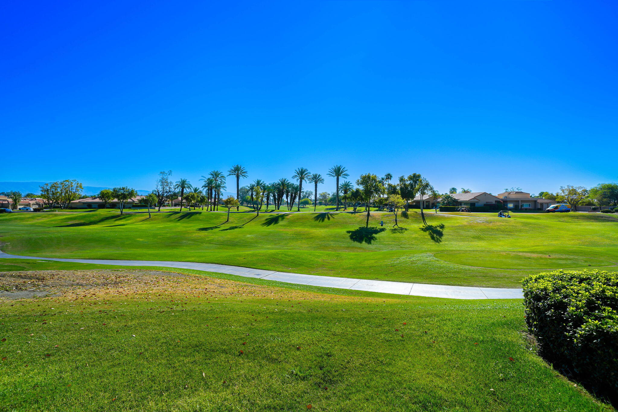 55 Colonial Drive Rancho Mirage, CA 92270 - Photo 21 of 31 a view of a golf course with a lake