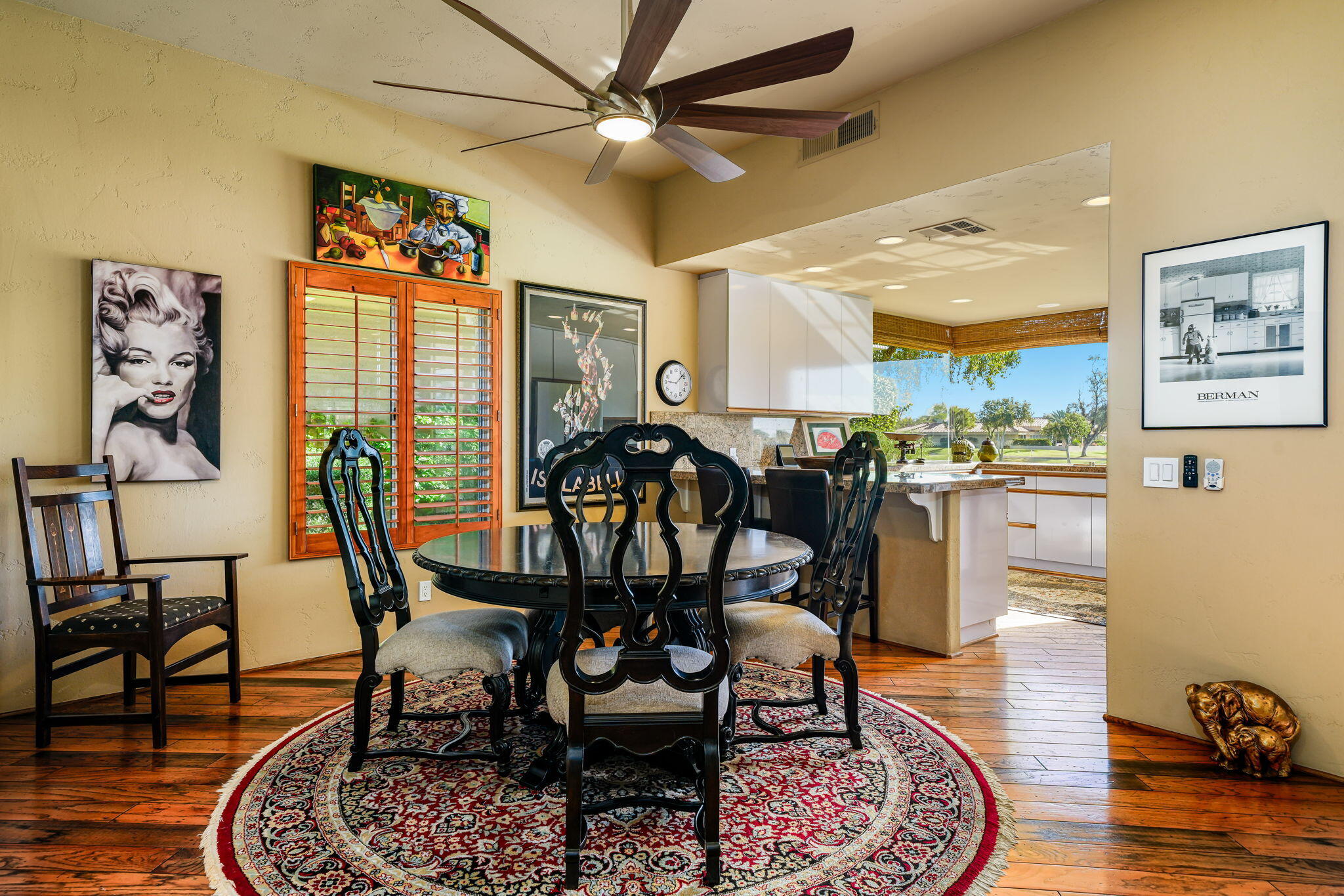 55 Colonial Drive Rancho Mirage, CA 92270 - Photo 8 of 31 a dining room with furniture a rug and wooden floor
