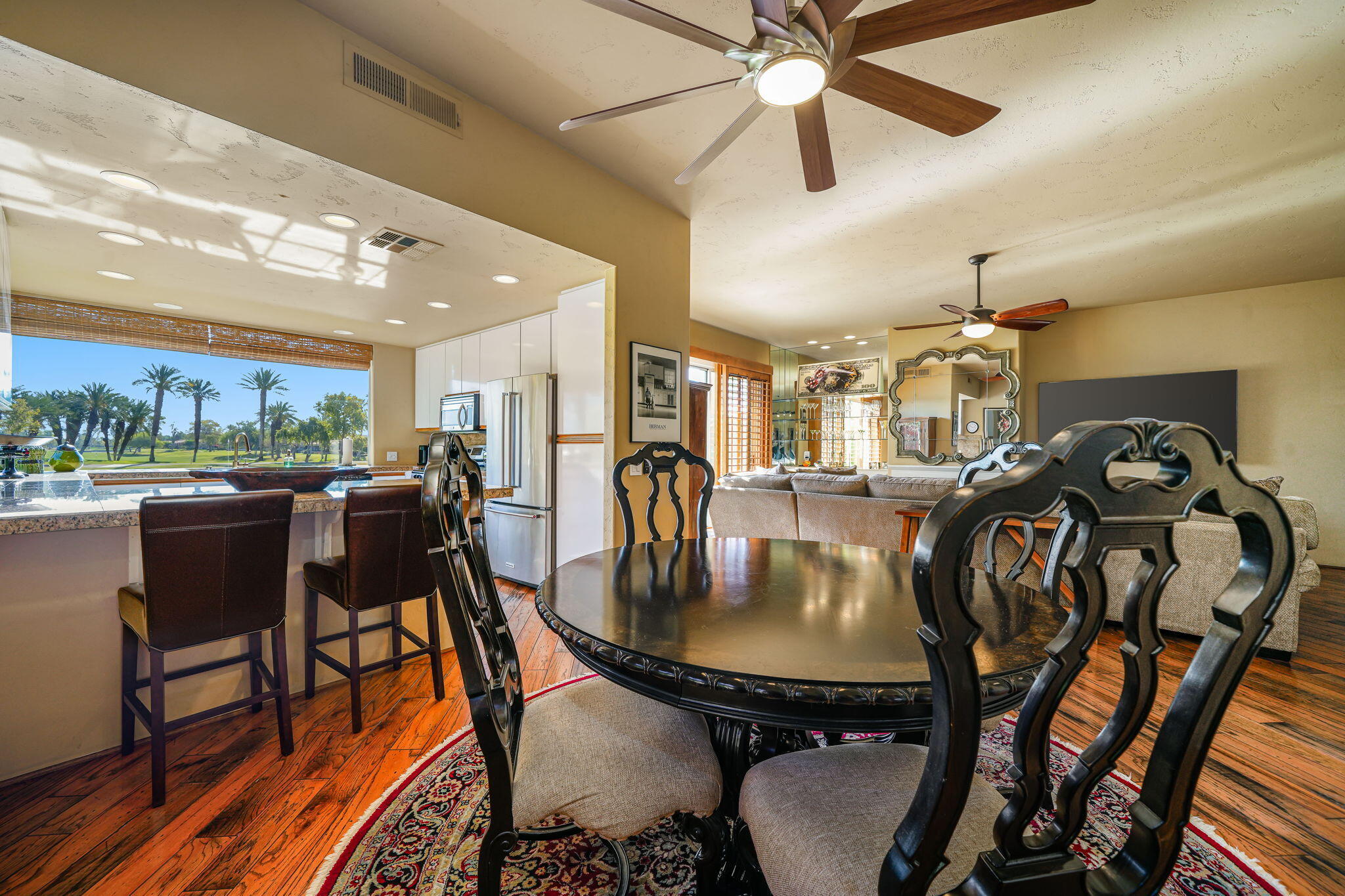 55 Colonial Drive Rancho Mirage, CA 92270 - Photo 9 of 31 a dining room with furniture and a floor to ceiling window