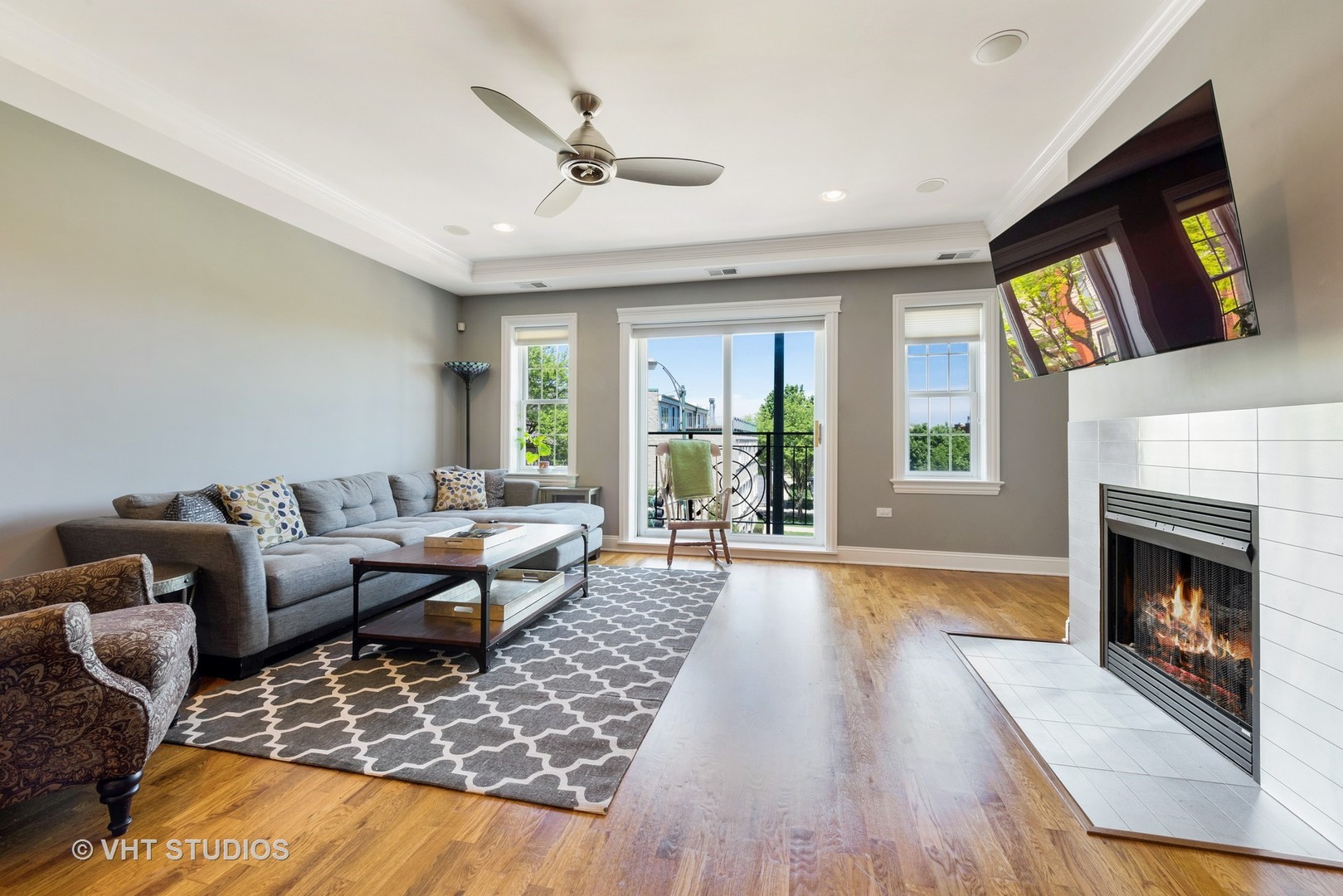 1909 West Diversey Parkway, Unit 302 Chicago, IL 60614 - Photo 2 of 12 a living room with furniture large window and a fireplace