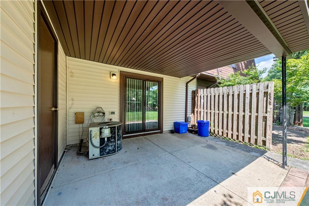 6302 Hana Road Edison, NJ 08817 - Photo 19 of 21 a view of a porch with furniture and floor to ceiling window