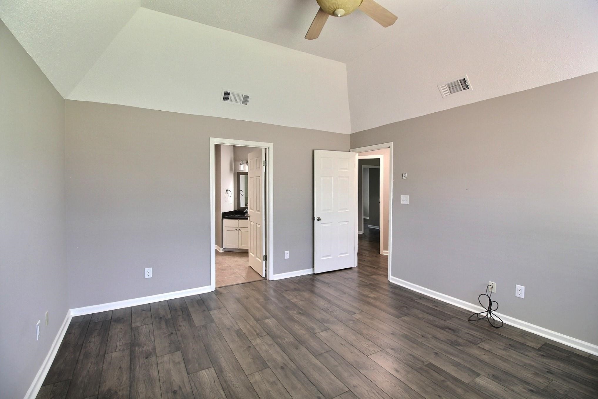 244 Saybrook Cove Collierville, TN 38017 - Photo 11 of 28 a view of an empty room with wooden floor