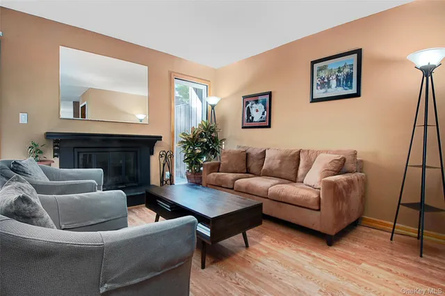 a view of a livingroom with furniture and a flat screen tv